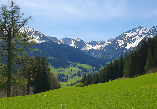 kleinwalsertal-alpenlandschaft-schneebedeckte-berge-fruehling